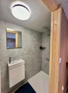 a bathroom with a toilet and a sink and a mirror at Cosy@Beauty in Petit-Rechain