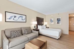 a hotel room with a bed and a couch at DoubleTree by Hilton Columbus in Columbus