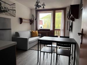 Posezení v ubytování da Robi appartamento fronte piste