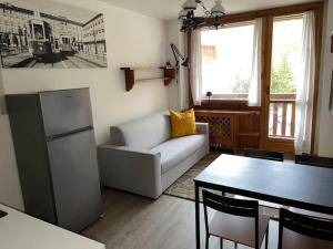 Posezení v ubytování da Robi appartamento fronte piste