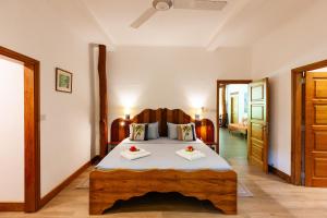 Postel nebo postele na pokoji v ubytování Anse Lazio Lodge
