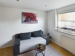 a living room with a couch and a window at Aldorf 4 in Alsdorf