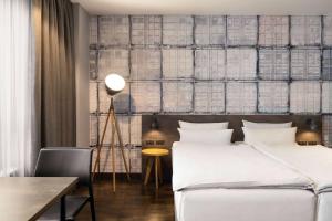 Cama o camas de una habitación en Vienna House Easy by Wyndham Bremen City Apartments