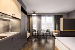Cama o camas de una habitación en Vienna House Easy by Wyndham Bremen City Apartments