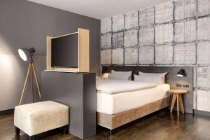 Cama o camas de una habitación en Vienna House Easy by Wyndham Bremen City Apartments