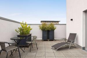 Un balcón o terraza de Vienna House Easy by Wyndham Bremen City Apartments
