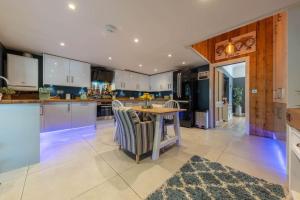 a kitchen with a table and chairs in a kitchen at 58D Earlham Road in Norwich