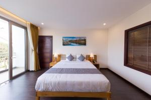 Katil atau katil-katil dalam bilik di Silk and Sea Hotel