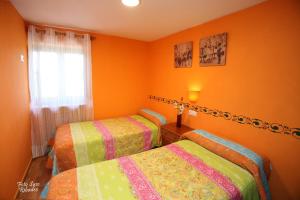 Postel nebo postele na pokoji v ubytování Apartamentos Bouso