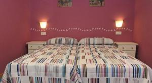 Postel nebo postele na pokoji v ubytování Apartamentos Bouso