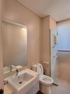 a bathroom with a sink and a toilet and a shower at 2 BR & 2 BTH with Free Parking @ Near ThemePark, SnowWalk & Central I-City Mall in Shah Alam