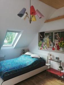 a bedroom with a bed and a window at Space Loft Graz in Graz