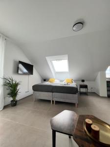 a bedroom with a bed and a table in it at BnB Open Apartments Pader-Stars in Paderborn