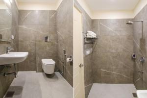 a bathroom with a toilet and a sink and a shower at Hotel Florida -Manali Highway & 9 mins drive from Chandigarh University in Kharar