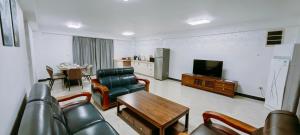 TV a/nebo společenská místnost v ubytování Ocean Breeze Apartment