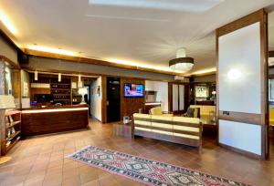 a living room with a couch and a table at Hotel Bella Venezia in Latisana