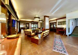 a large living room with a couch and a table at Hotel Bella Venezia in Latisana