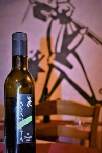 a bottle of wine sitting on top of a table at Agriturismo CasaMatta Azienda Agricola in Calenzano