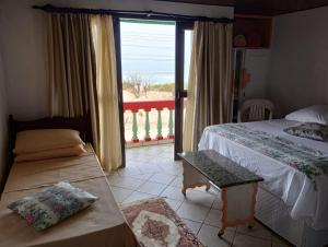 Voodi või voodid majutusasutuse Pousada Kanaxuê - Frente Mar e Lagoa toas