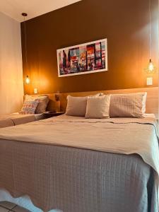 Una cama o camas en una habitación de Flat B306 Village Aldeia das Águas