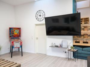 TV a/nebo společenská místnost v ubytování Ferienwohnung Jonte, FeWo Vermittlung Nordsee + 13 fotografií