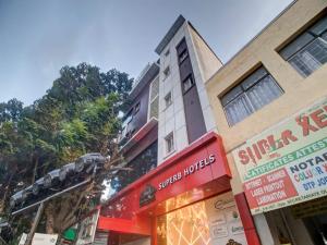 a building with a sign in front of a store at THE SUPERB HOTEL PVT LTD in Hyderabad
