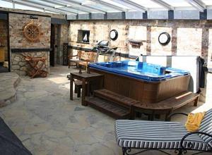 a large room with a large tub in a building at Casa rural EL CASTILLO DE CIRUELAS in Ciruelas