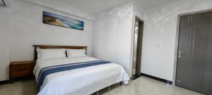 Postel nebo postele na pokoji v ubytování Ocean Breeze Apartment