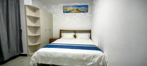 Postel nebo postele na pokoji v ubytování Ocean Breeze Apartment