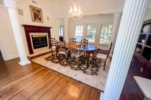 a dining room with a table and chairs and a fireplace at Lookout Crest in Lookout Mountain