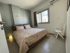 a bedroom with a bed and a window at Rent a Home Hurghada in Hurghada