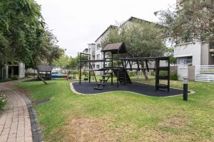 a park with a playground with a swing at Dainfern K Luxe Apartment in Sandton