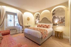 a bedroom with a king sized bed with arched ceilings at La Dimora del Mercante in Florence