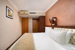 Postel nebo postele na pokoji v ubytování Elan Hotel Istanbul Pera