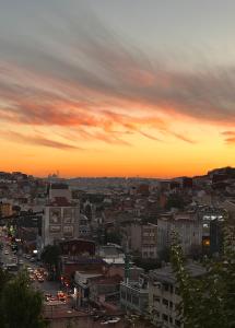 a view of a city at sunset at NarPera Taksim Boutique Hotel in Istanbul
