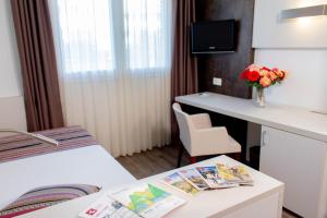 TV o dispositivi per l'intrattenimento presso Colorado Hotel