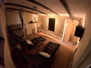 a view of a room with two benches in a house at Agriturismo La Contessa Quarter Horse in Gubbio +29 photos