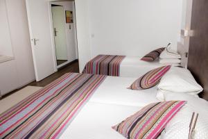 Letto o letti in una camera di Colorado Hotel