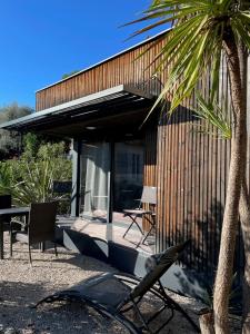 a house with a palm tree in front of it at Studio indépendant in Vence