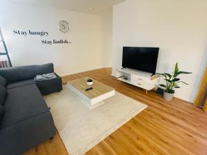 TV a/nebo společenská místnost v ubytování modern * gemütlich * Nespresso * Terrasse * Netflix