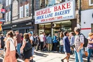 a crowd of people standing outside of a brick lane bakery at Shoreditch / Brick Lane - Studio in London