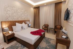 Voodi või voodid majutusasutuse Ramage Hotel & Resort toas