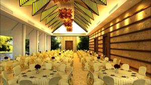 a banquet hall with white tables and white chairs at Aswadduma Hotel in Dambulla +63 photos