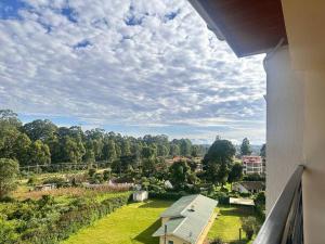 a view from a balcony of a house with a yard at Luxurious 2 bedroom penthouse-Fully Furnished at 360 Luxury in Kitale