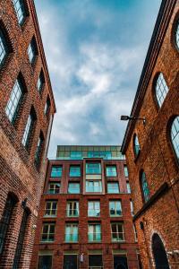 a tall brick building with a clock on it at Ropewalks Hotel - BW Premier Collection in Liverpool