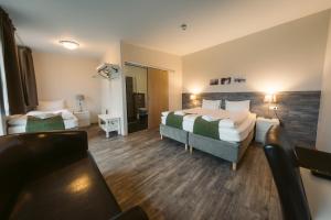 Postel nebo postele na pokoji v ubytování Hotel Vos