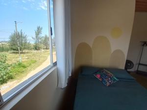 Postel nebo postele na pokoji v ubytování Mar de Arraial, Suites da Ju