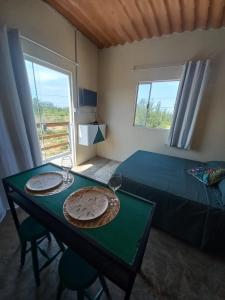 Postel nebo postele na pokoji v ubytování Mar de Arraial, Suites da Ju
