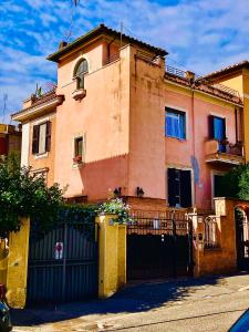 a building with a gate in front of it at La Casetta di San Giovanni in Rome