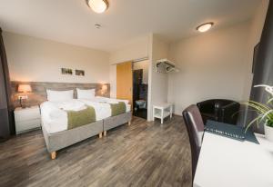 Postel nebo postele na pokoji v ubytování Hotel Vos